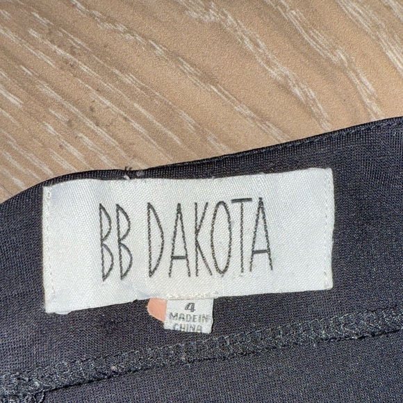 Black mini skirt BB Dakota featuring a unique diagonal sheer mesh panel detail.4 - Picture 6 of 8